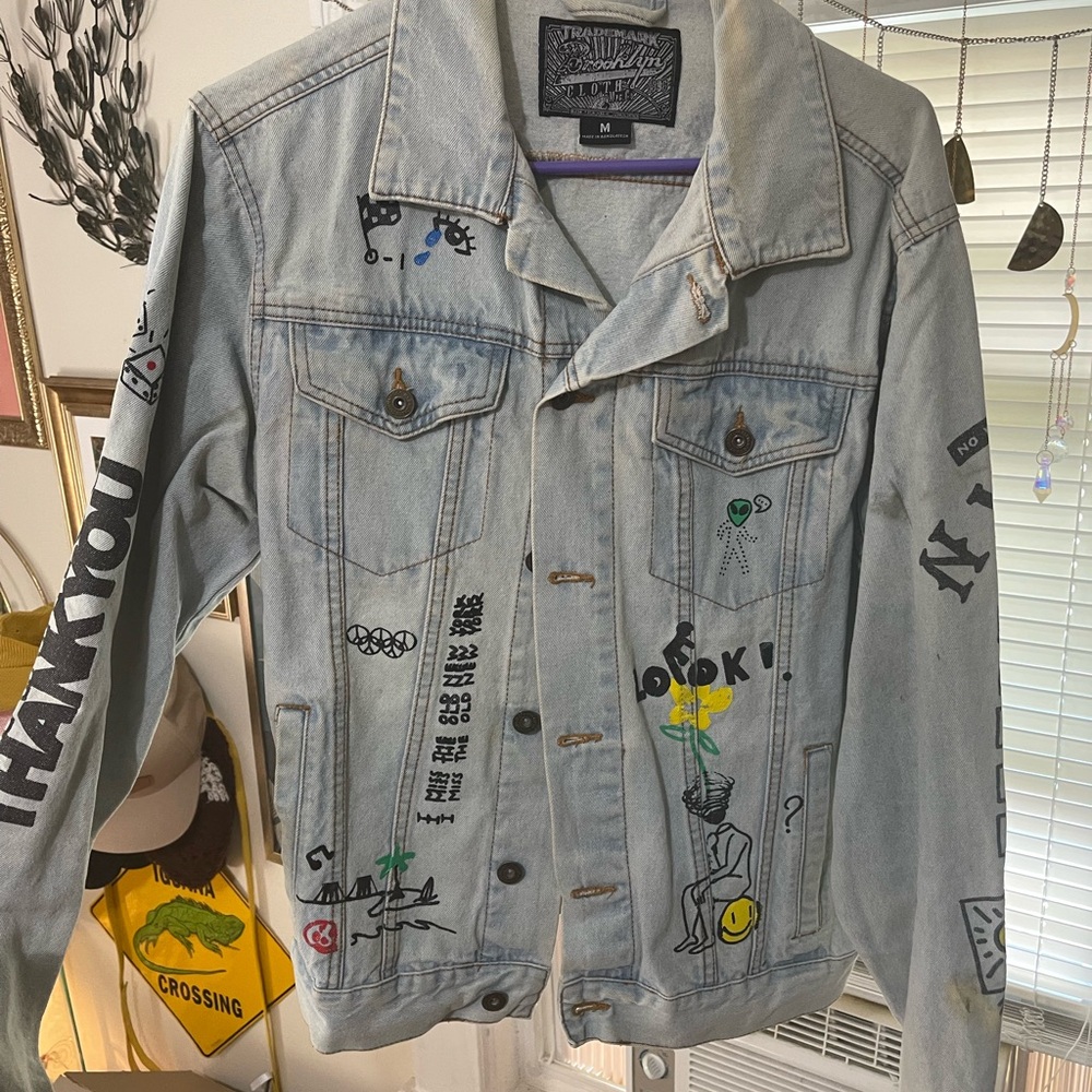 distressed graffiti denim jacket